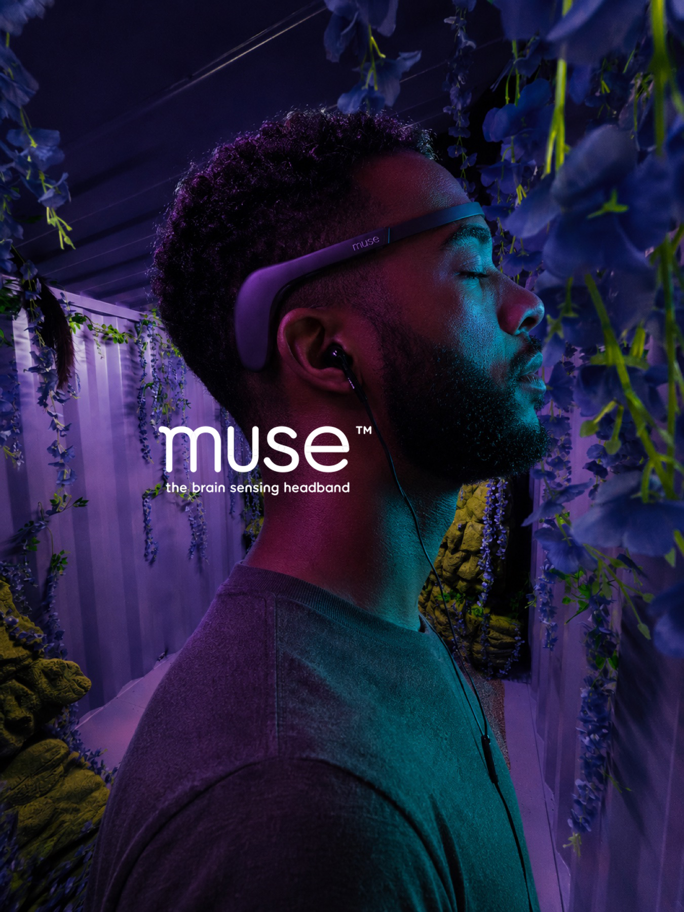 Manuel wearing a Muse EEG headset inside a purple immersive installation
