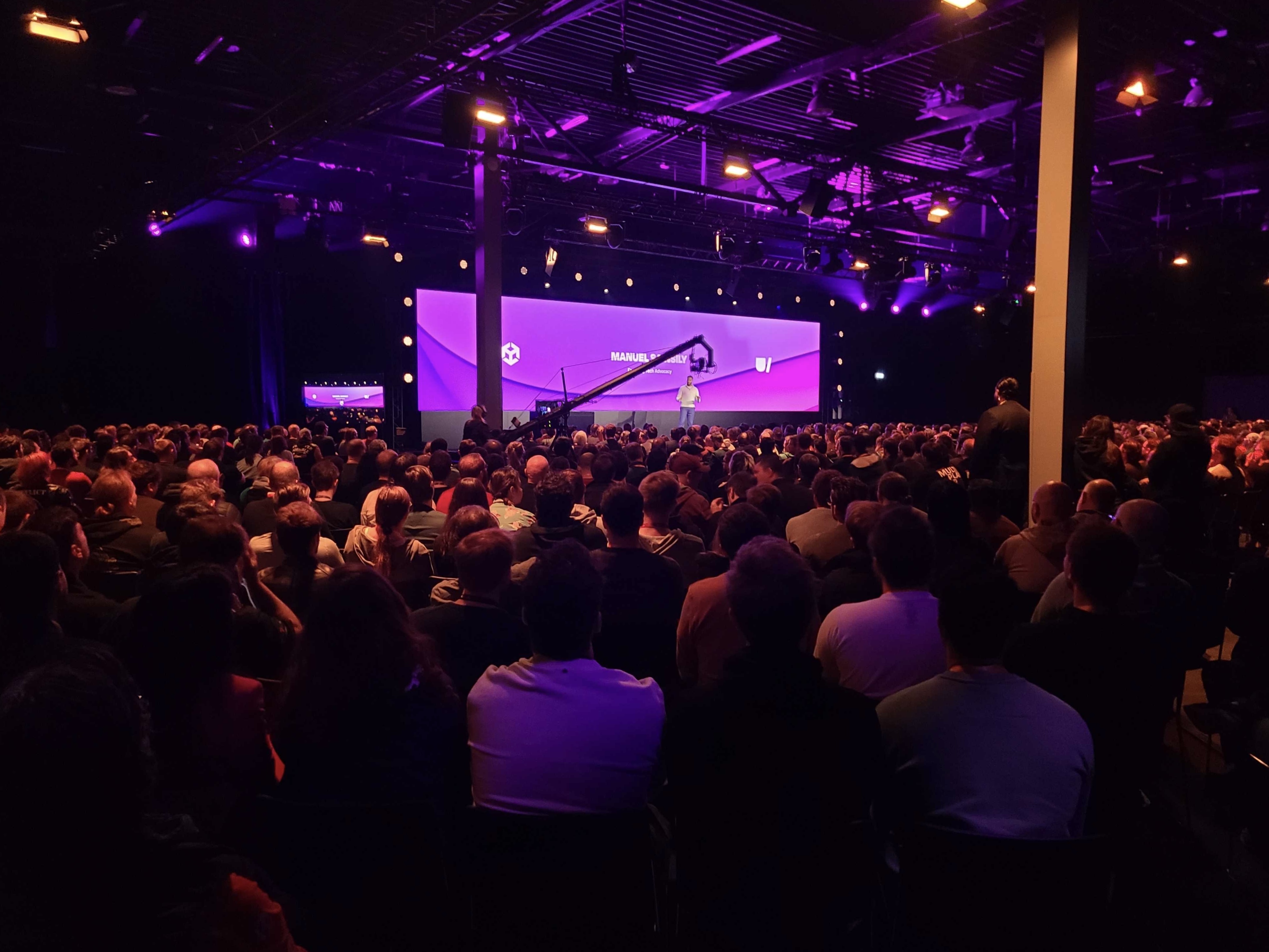 Manuel speaking to a large audience at Unite Tokyo